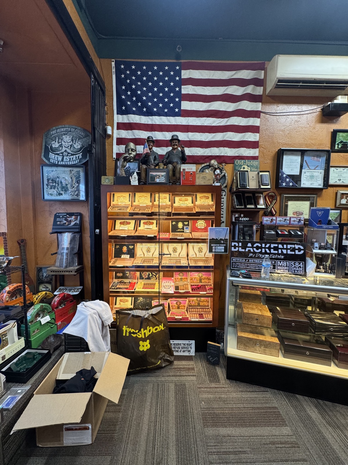 American flag and cigar display honoring the shop's military community